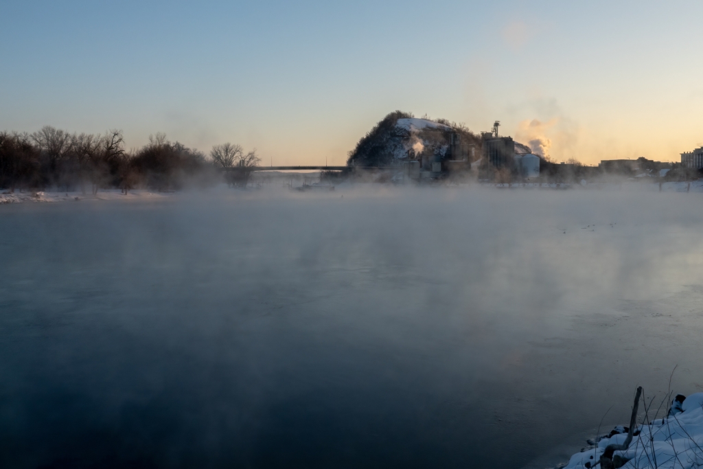 Steam fog emanating from Mississippi River on subzero morning at Bay Point Park in Red Wing, Minnesota